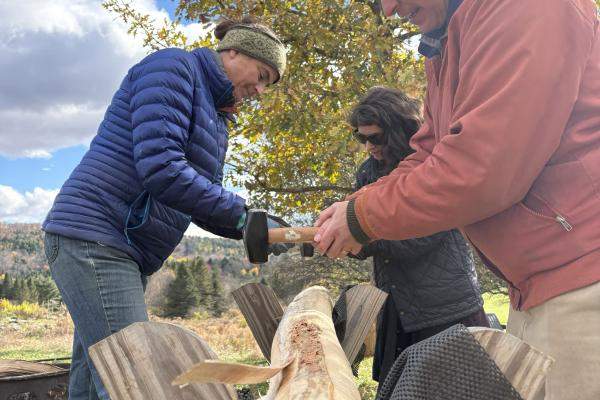 Three people pounds splints from a black ash log.