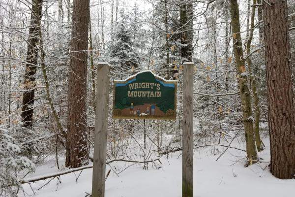 Wright's Mountain sign in snow