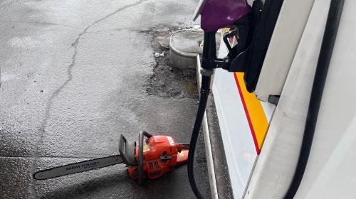 chainsaw and gas pump