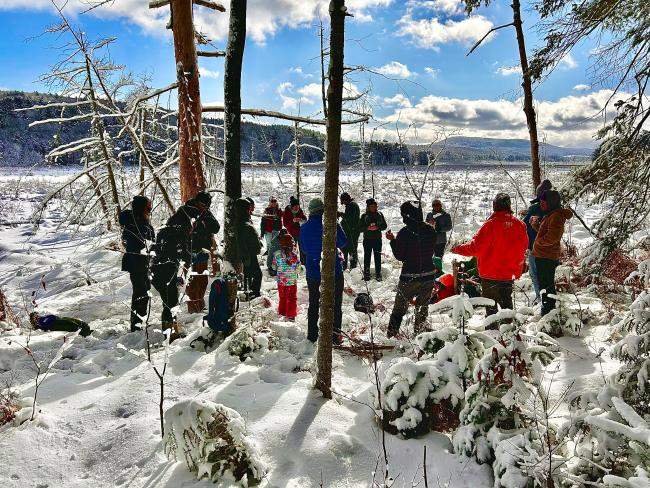 Group gathered in snow by Tinmouth Channel